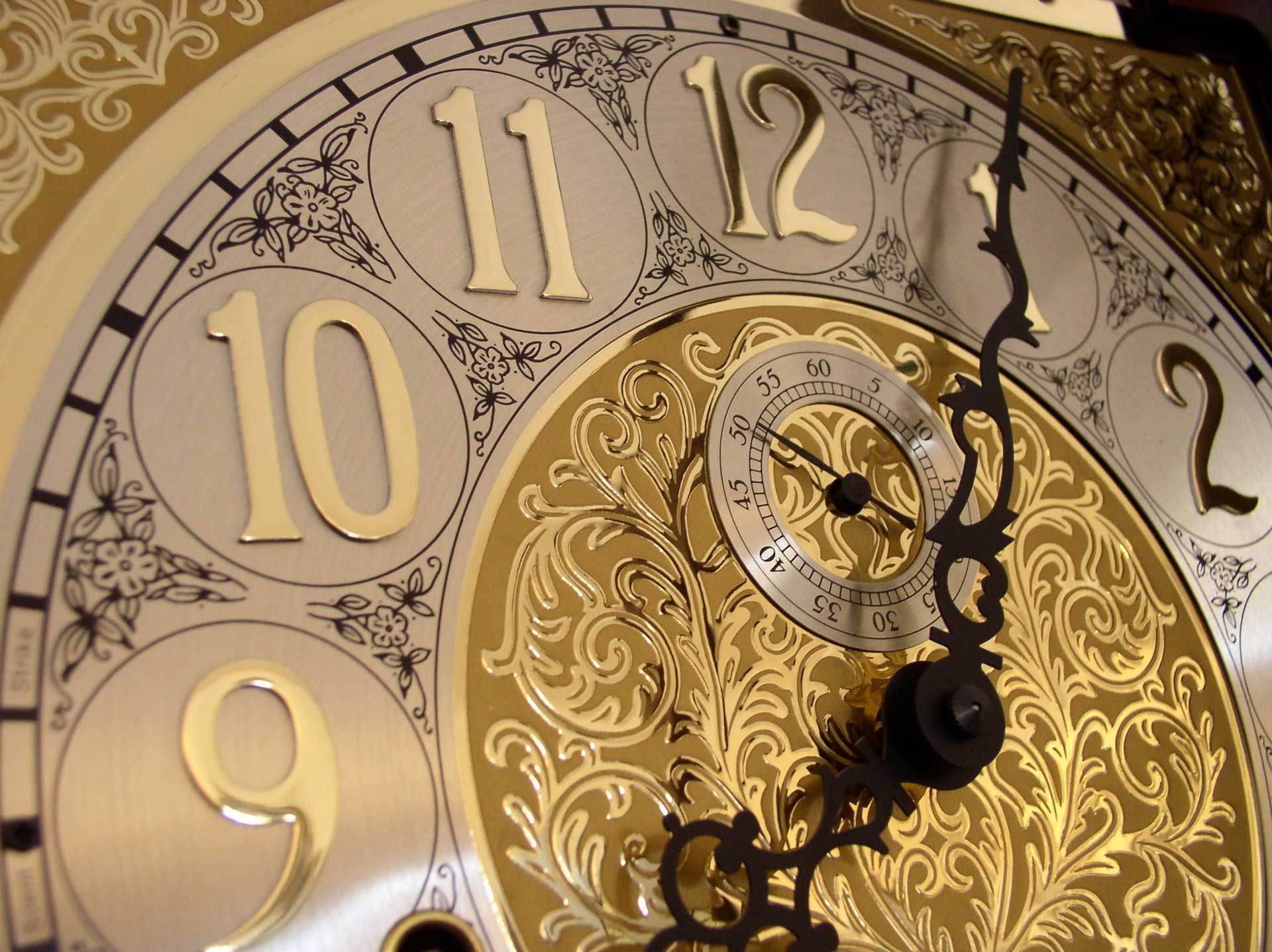 Time on a grandfather clock.