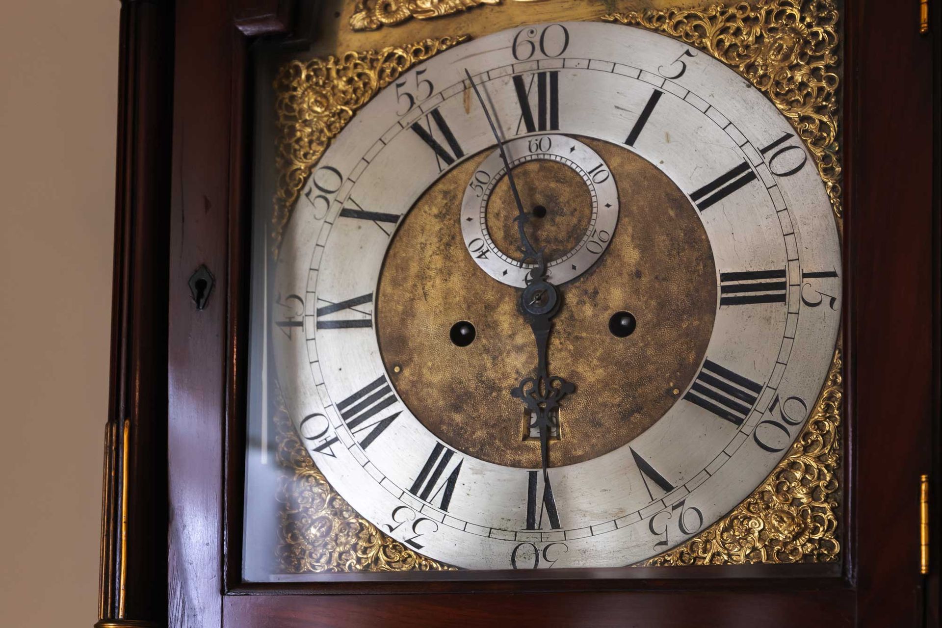 Vintage grandfather clock deal with Roman numerals.