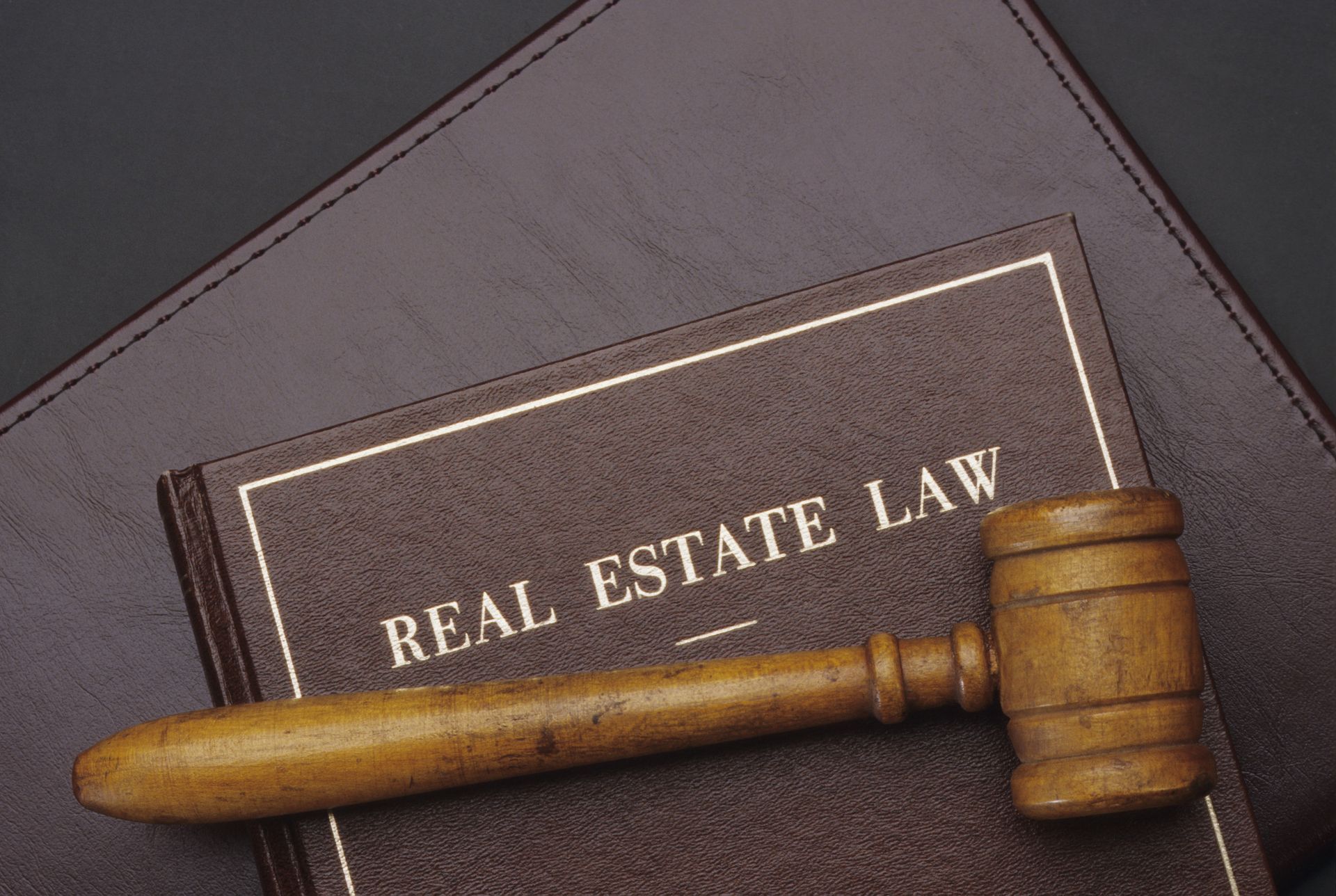 Real estate law book with gavel