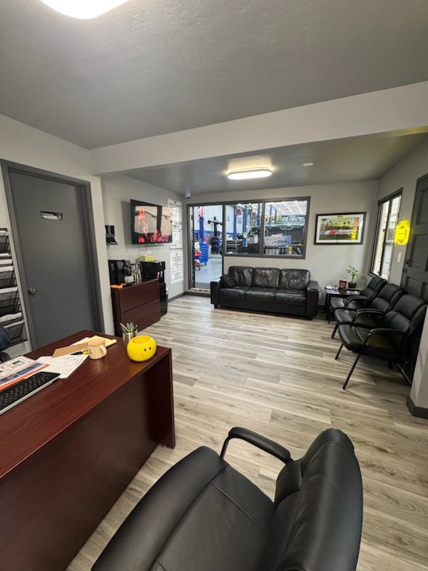 Waiting Room with Couch, Desk and Chairs | AK Auto Repair