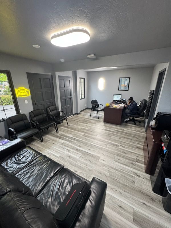 Waiting Room with Couch, Desk and Chairs | AK Auto Repair