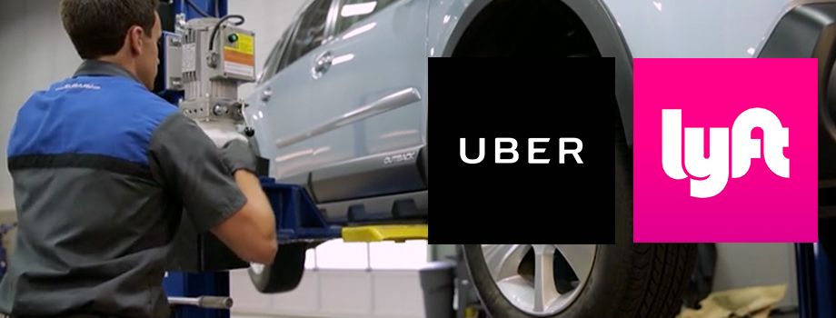 A man is working on a car in a garage next to an uber and lyn logo - AK Auto Repair