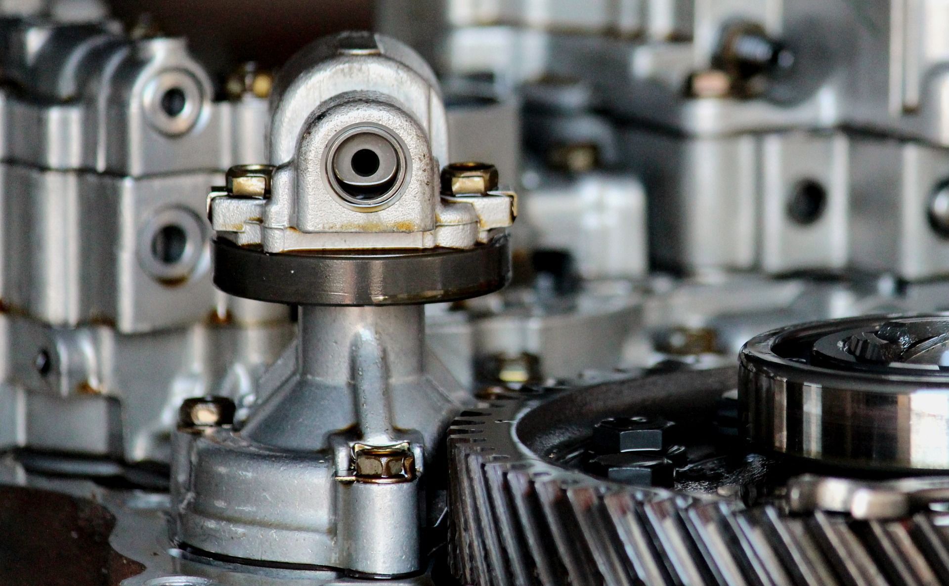 A close up of a gear in a car engine - AK Auto Repair