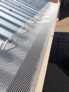 An aerial view of a roof with a chimney on it
