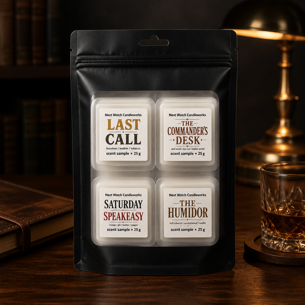 Black pouch with four labeled tea bags on a wooden desk beside books and a brass lamp.