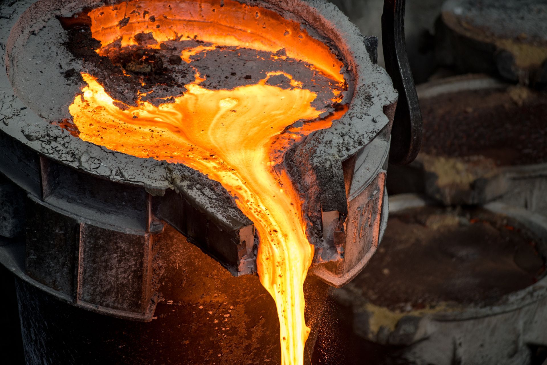 Tank pours liquid metal at the steel mill.