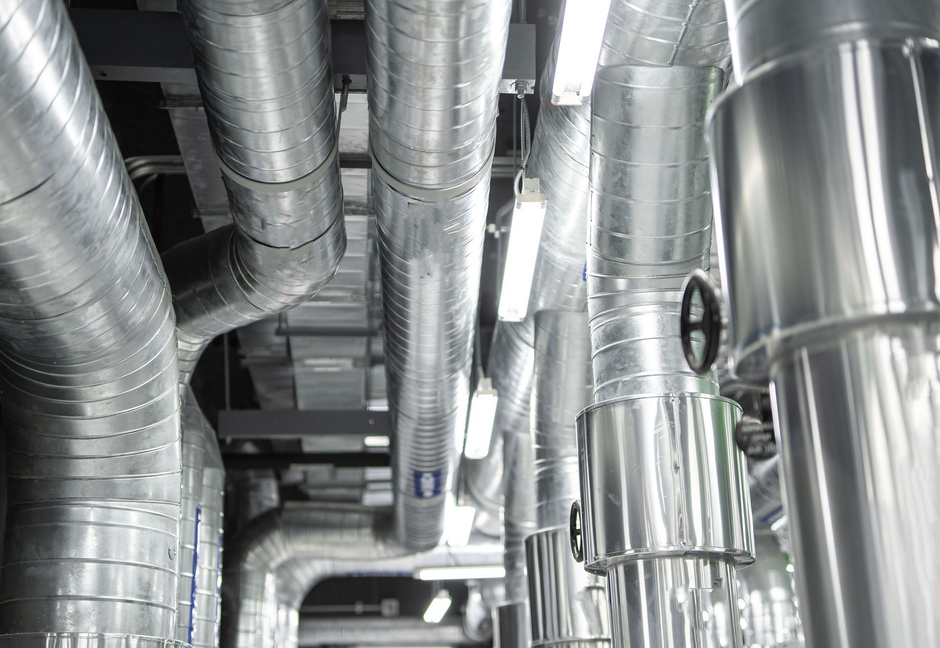 Steel pipelines and equipment with insulation at an industrial zone.