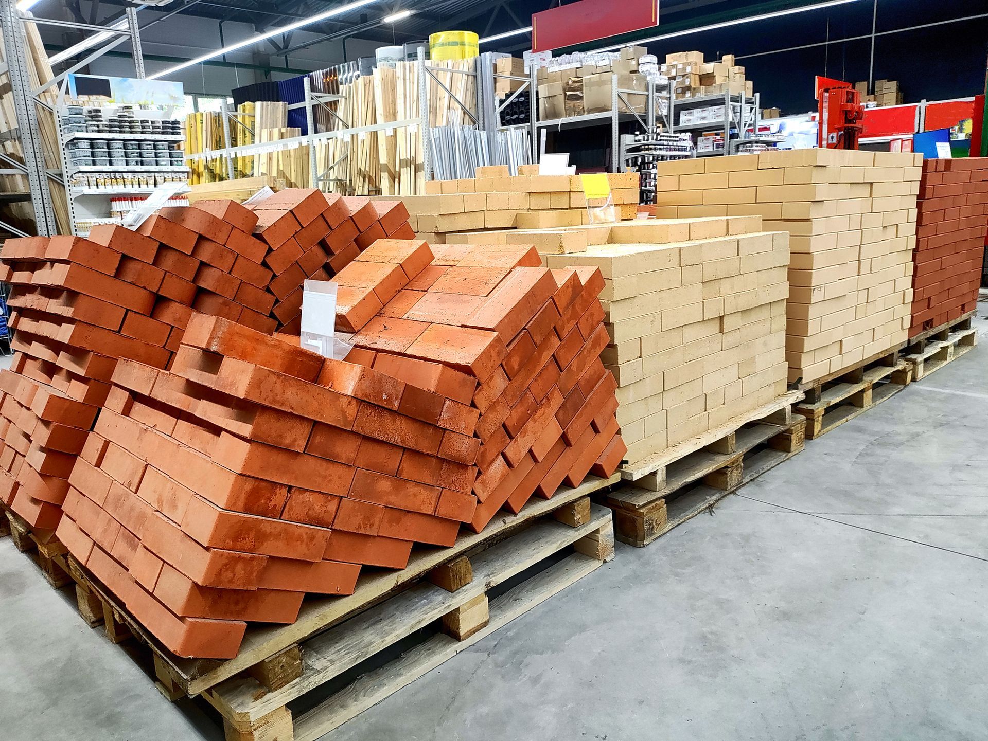 Stacks of insulating fire bricks displayed for sale at a refractory materials supplier Stacks of insulating fire bricks displayed for sale at a refractory materials supplier