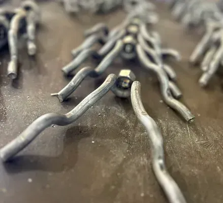 A close up of a bunch of metal pieces on a table.