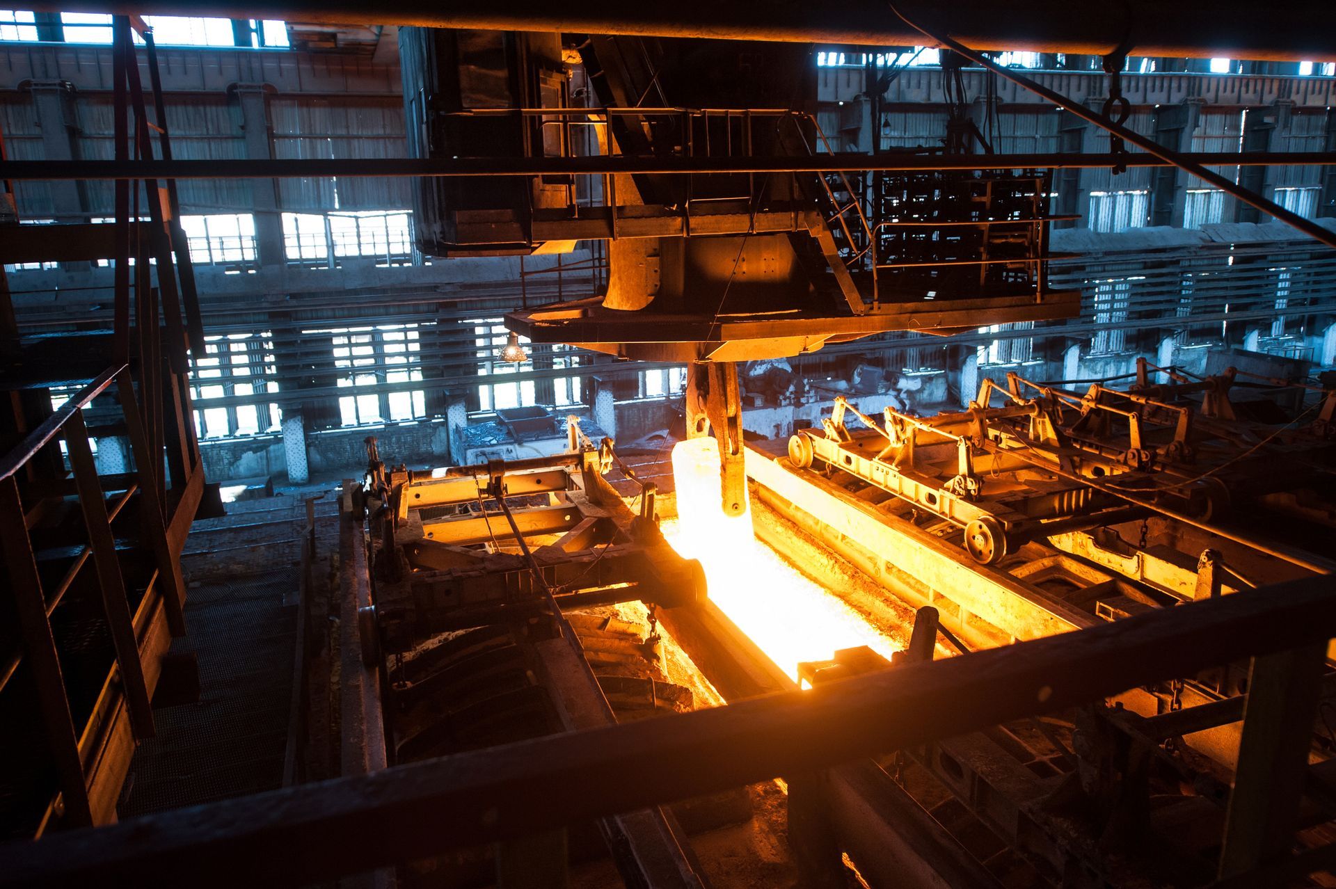 A factory with a lot of fire coming out of it