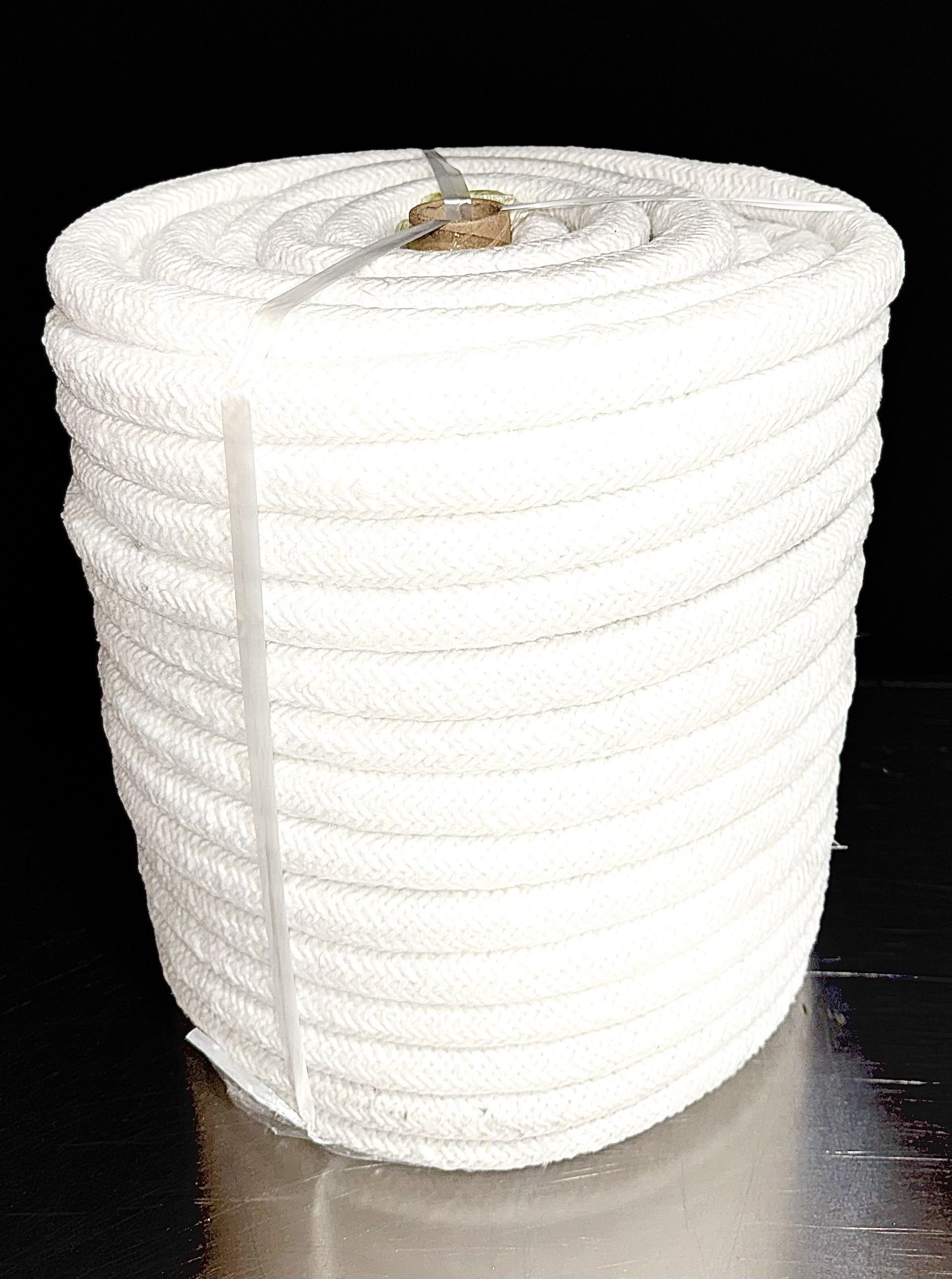A roll of ceramic fiber paper next to a box