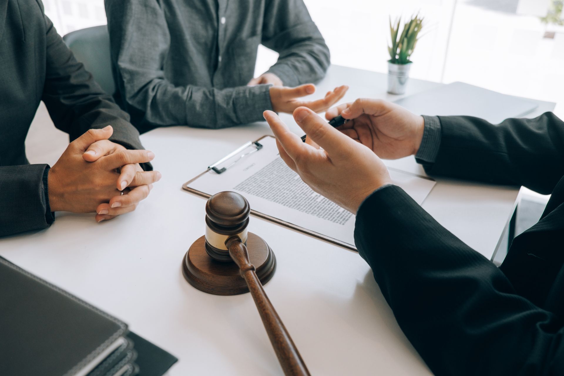 Lawyer and clients in a meeting.