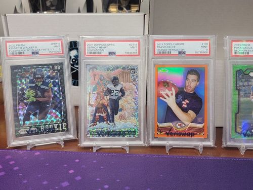 A group of football cards are sitting on a table.