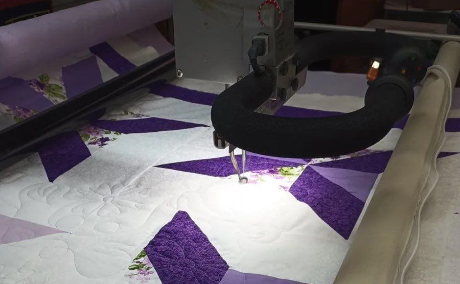 A longarm quilting machine in action.