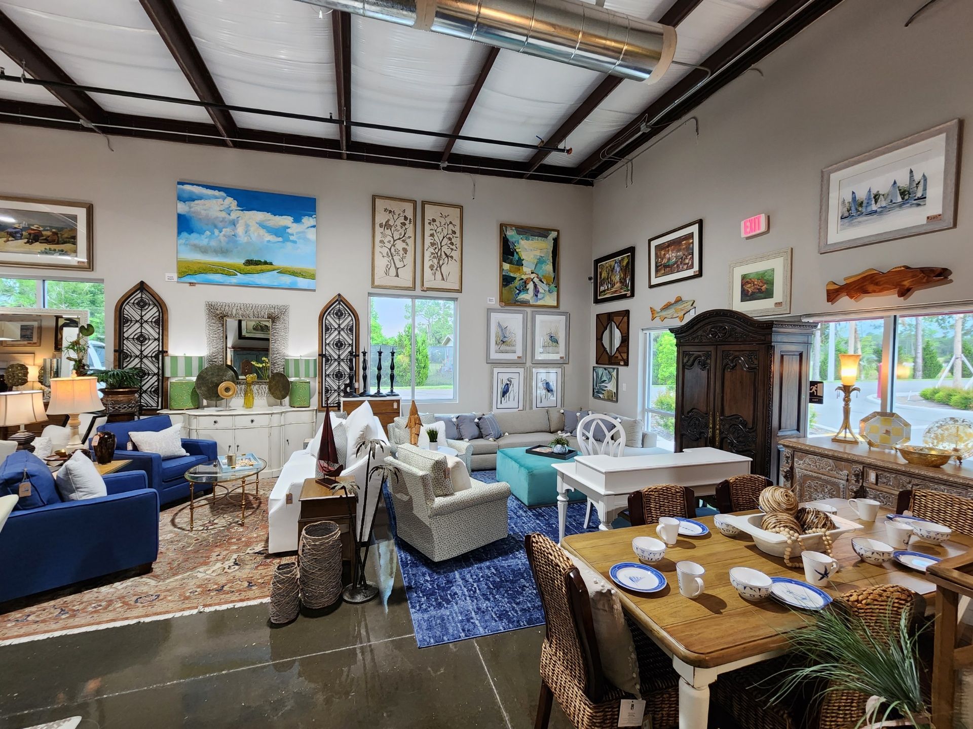 A living room filled with furniture and a dining table.