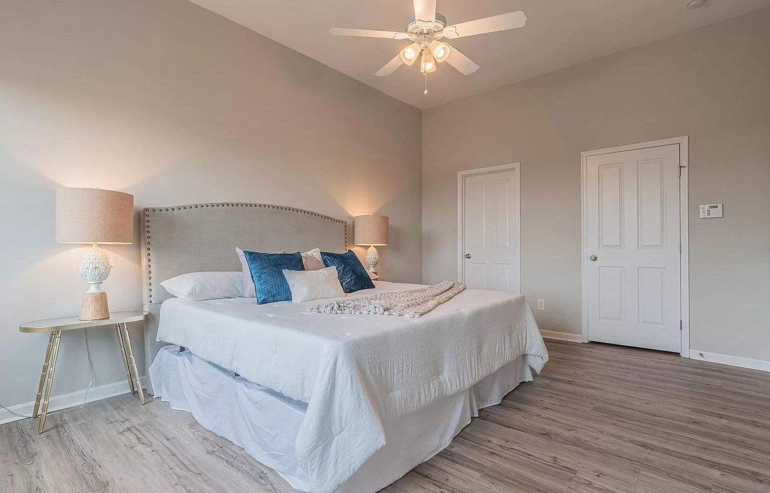 Southgate Townhomes - Bedroom with bed and celling fan