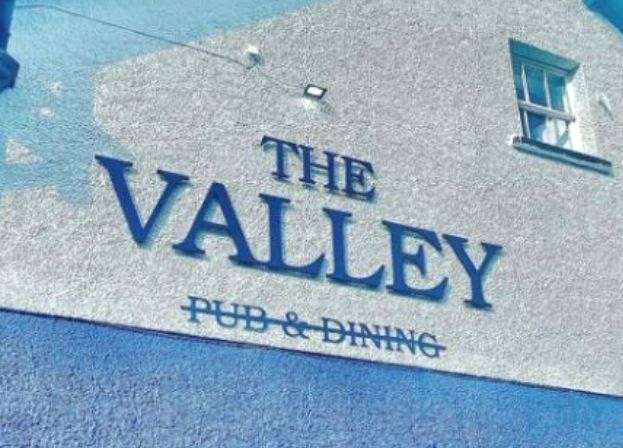 painting a barn, spray painting, paint spraying a barn,