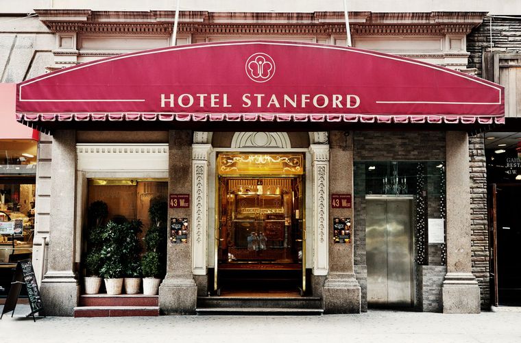 the hotel stanford has a red awning over the entrance