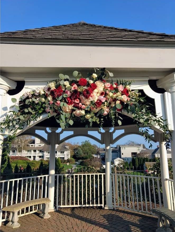 Tulips Floral Design located in Westbrook, CT creates beautiful wedding flower arches.