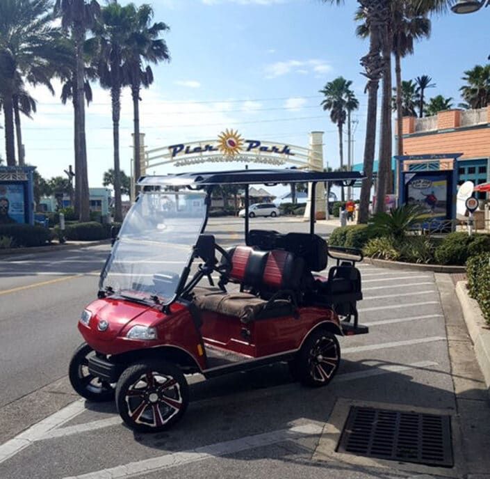 Red colored golf cart