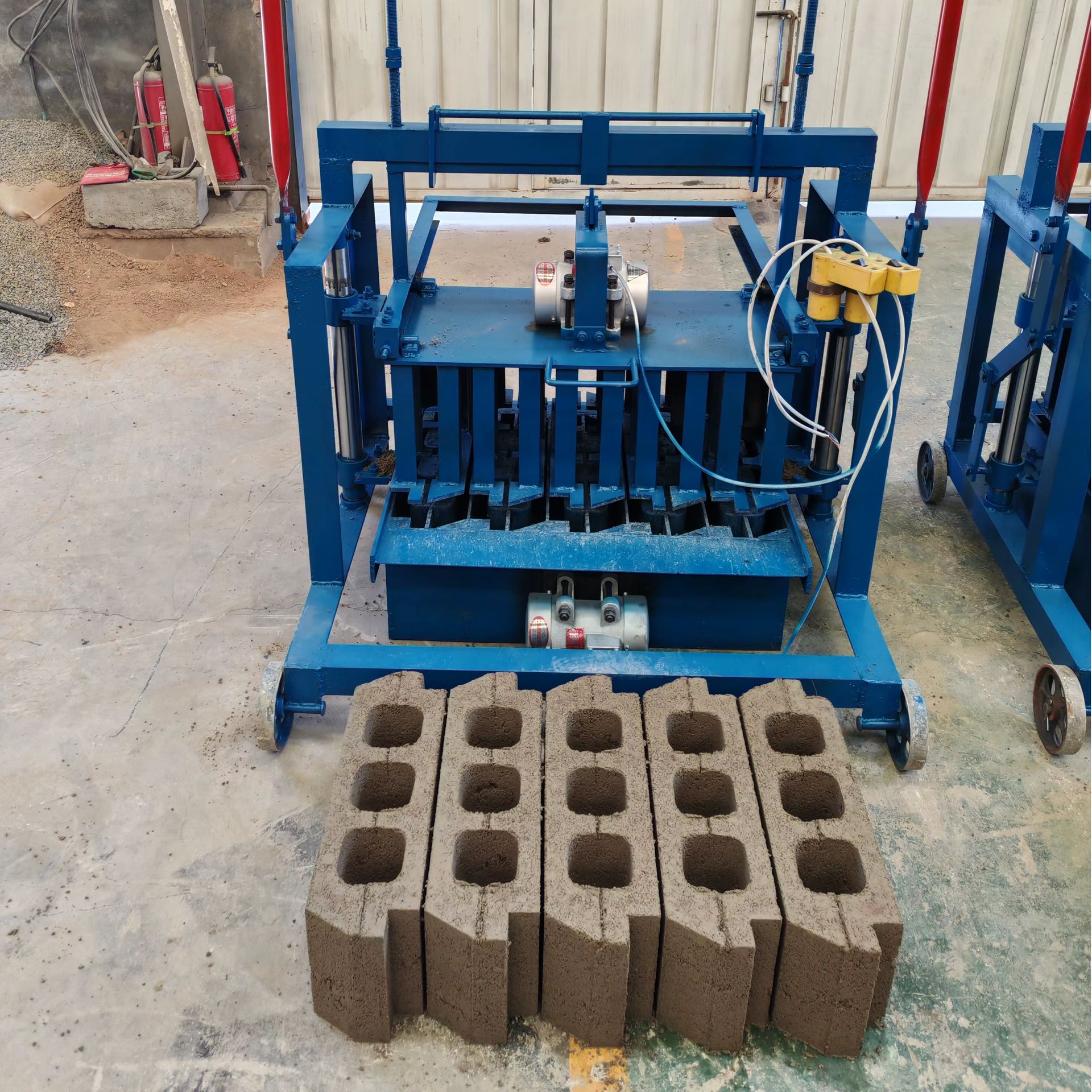 Small mobile block-making machine in operation