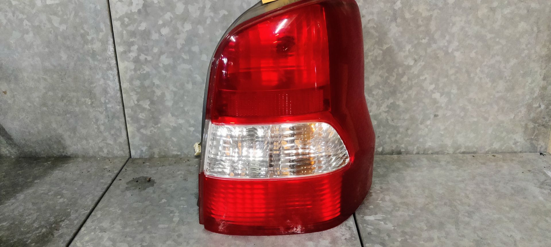 Mazda Demio rechter achterlicht bj 2001.