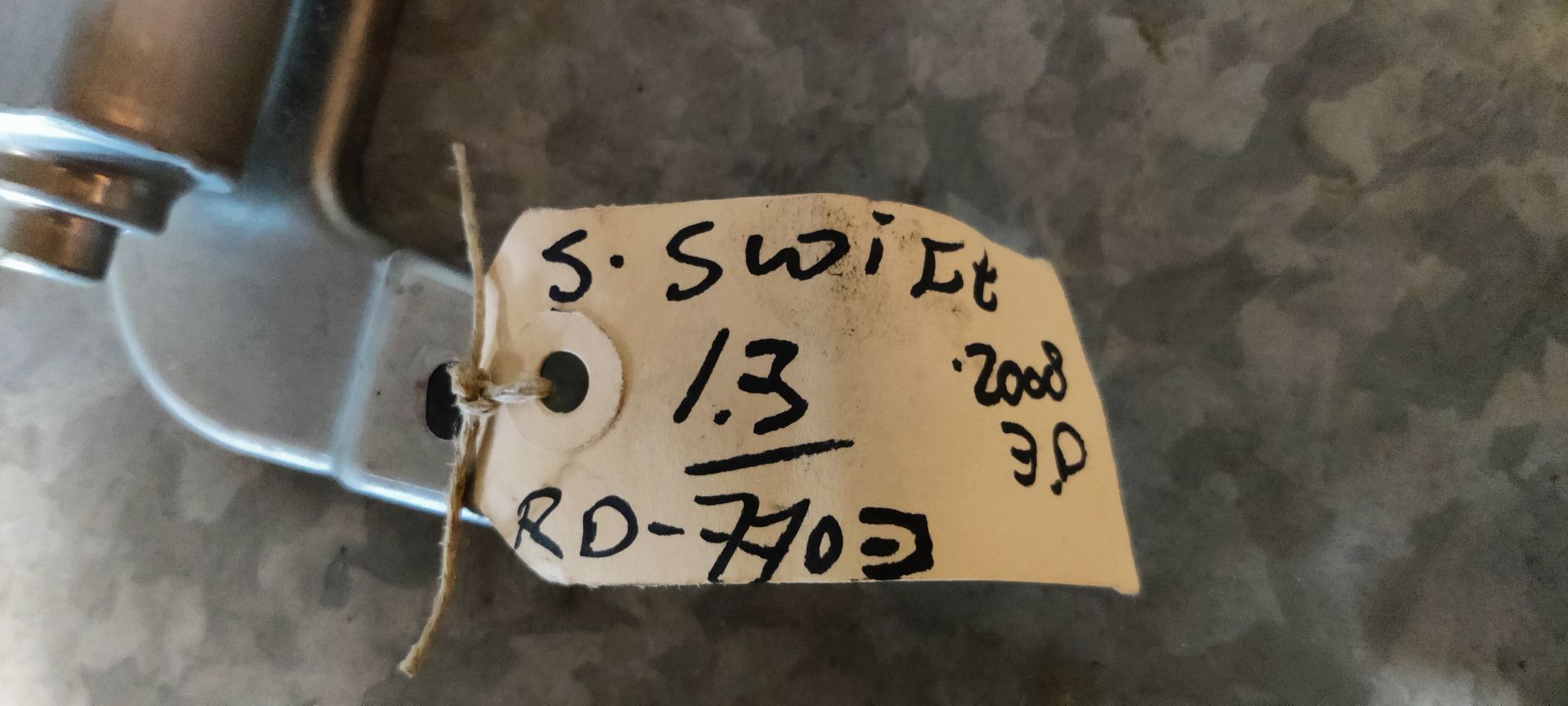 Suzuki Swift ruitenwissemotor achter.