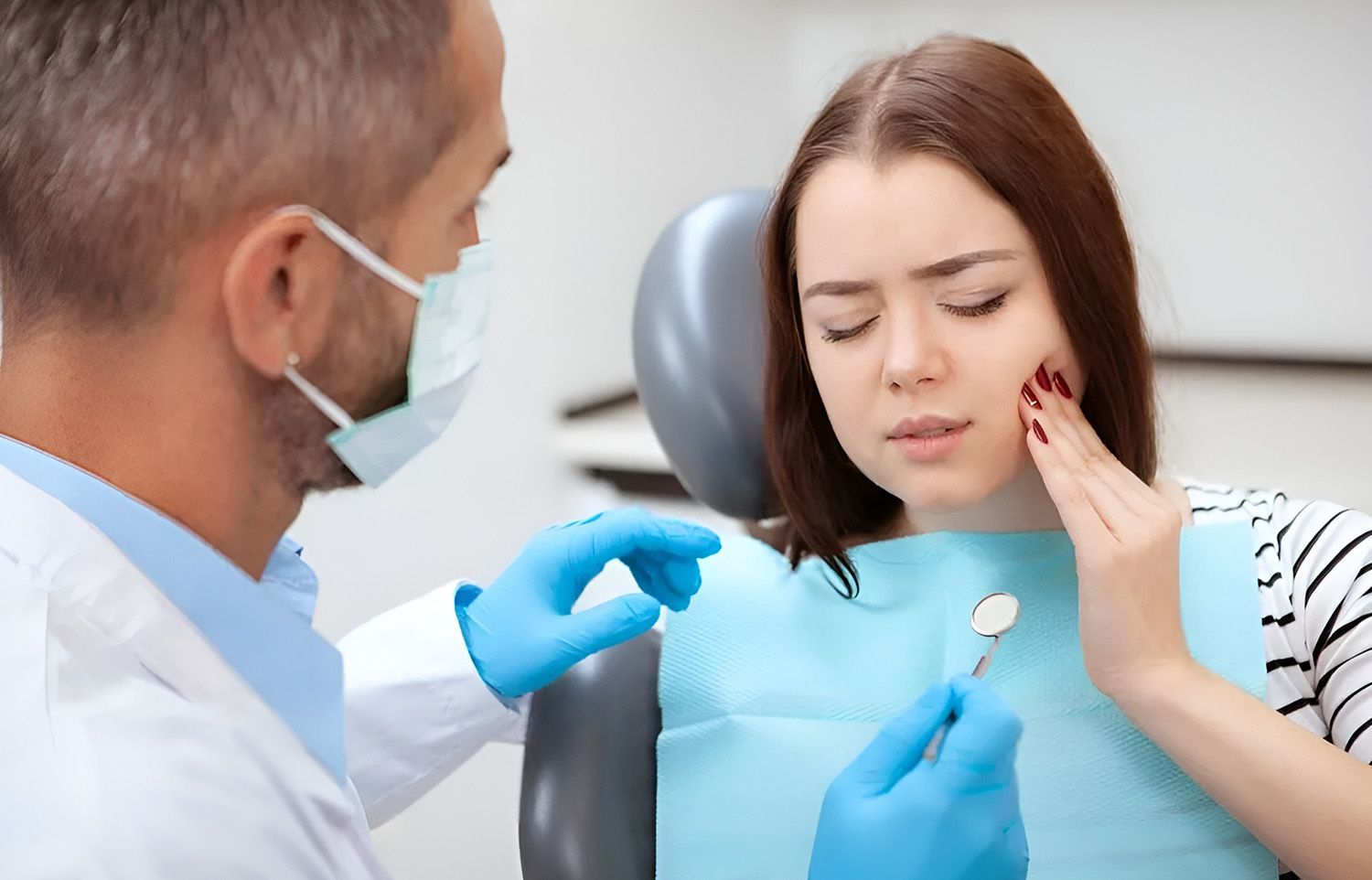 Dentist Examining Patient with Toothache