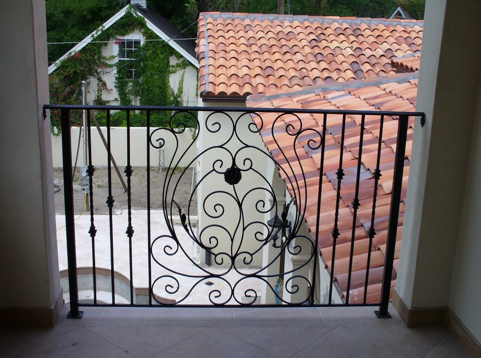 Staircase with dark wood steps and railing, glass panels, and white walls Staircase with dark wood steps and railing, glass panels, and white walls