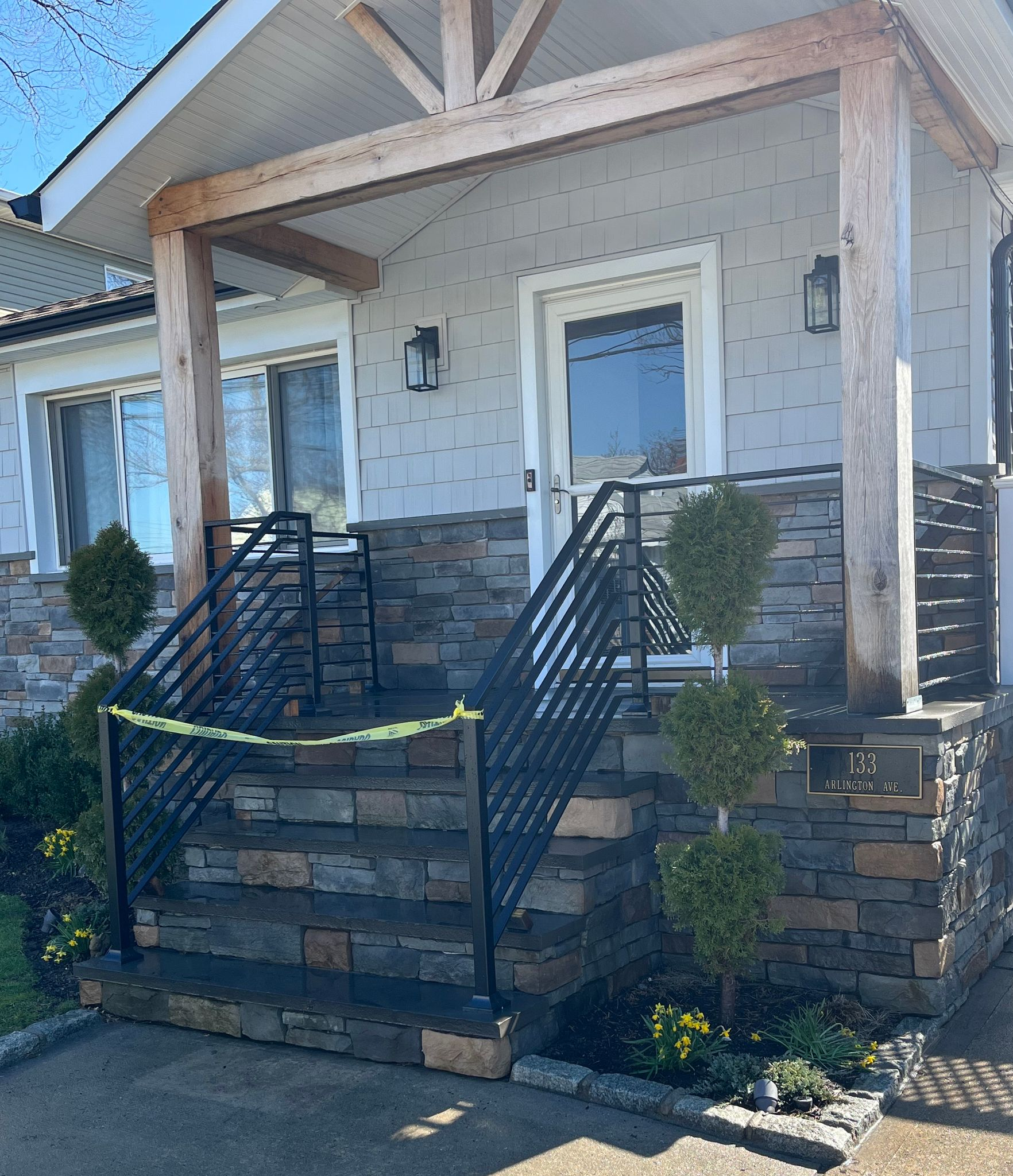 Wooden staircase with glass and metal railing in a modern, bright interior Wooden staircase with glass and metal railing in a modern, bright interior