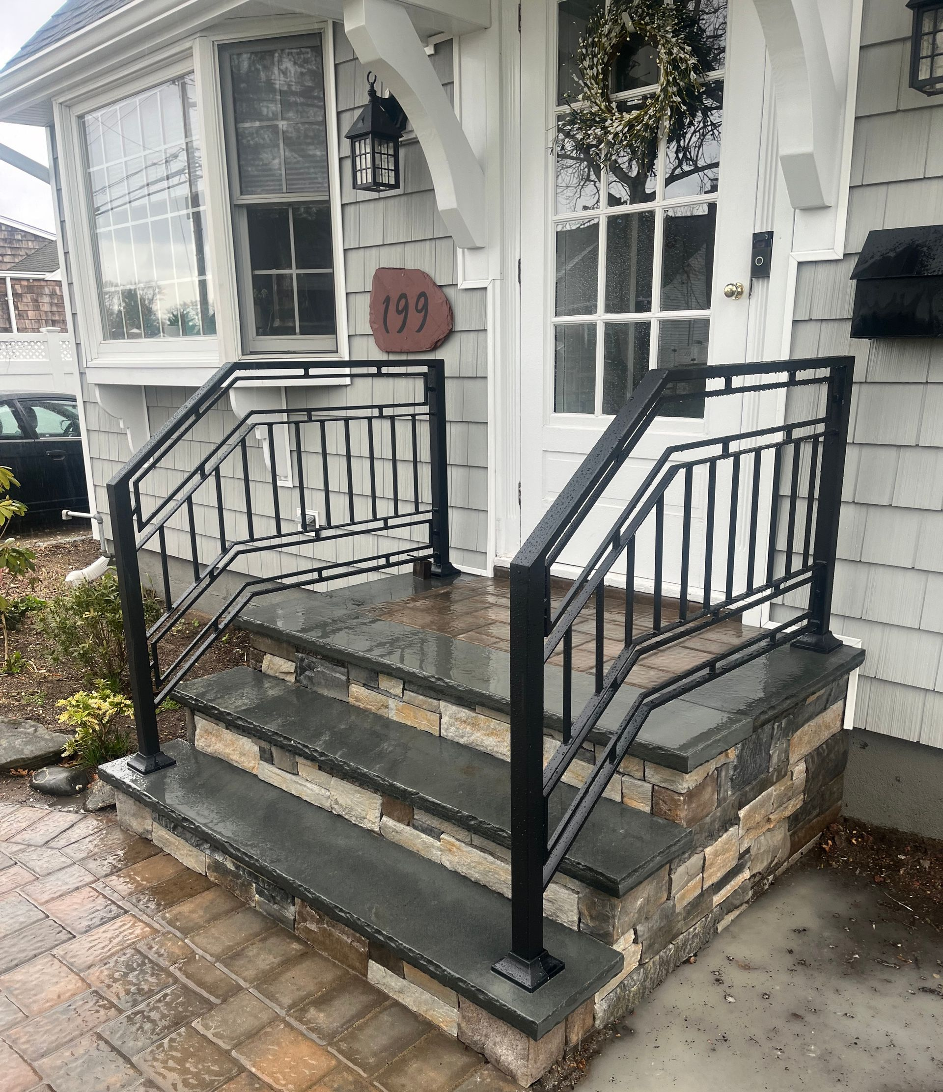 Beige tile floor, white walls, and ornate wrought-iron railing Beige tile floor, white walls, and ornate wrought-iron railing