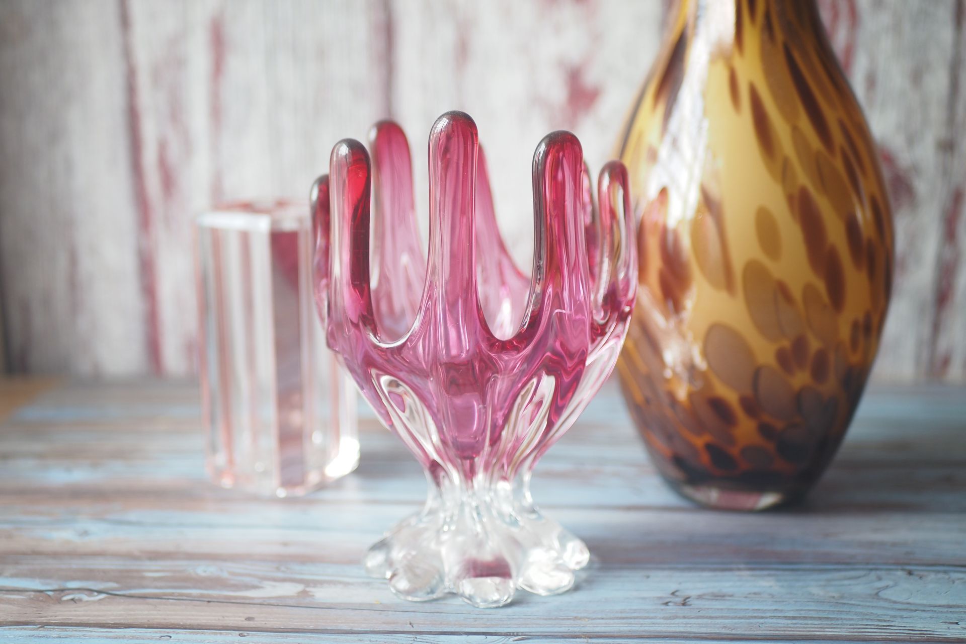 A sunset over a mountain range with a lot of fog