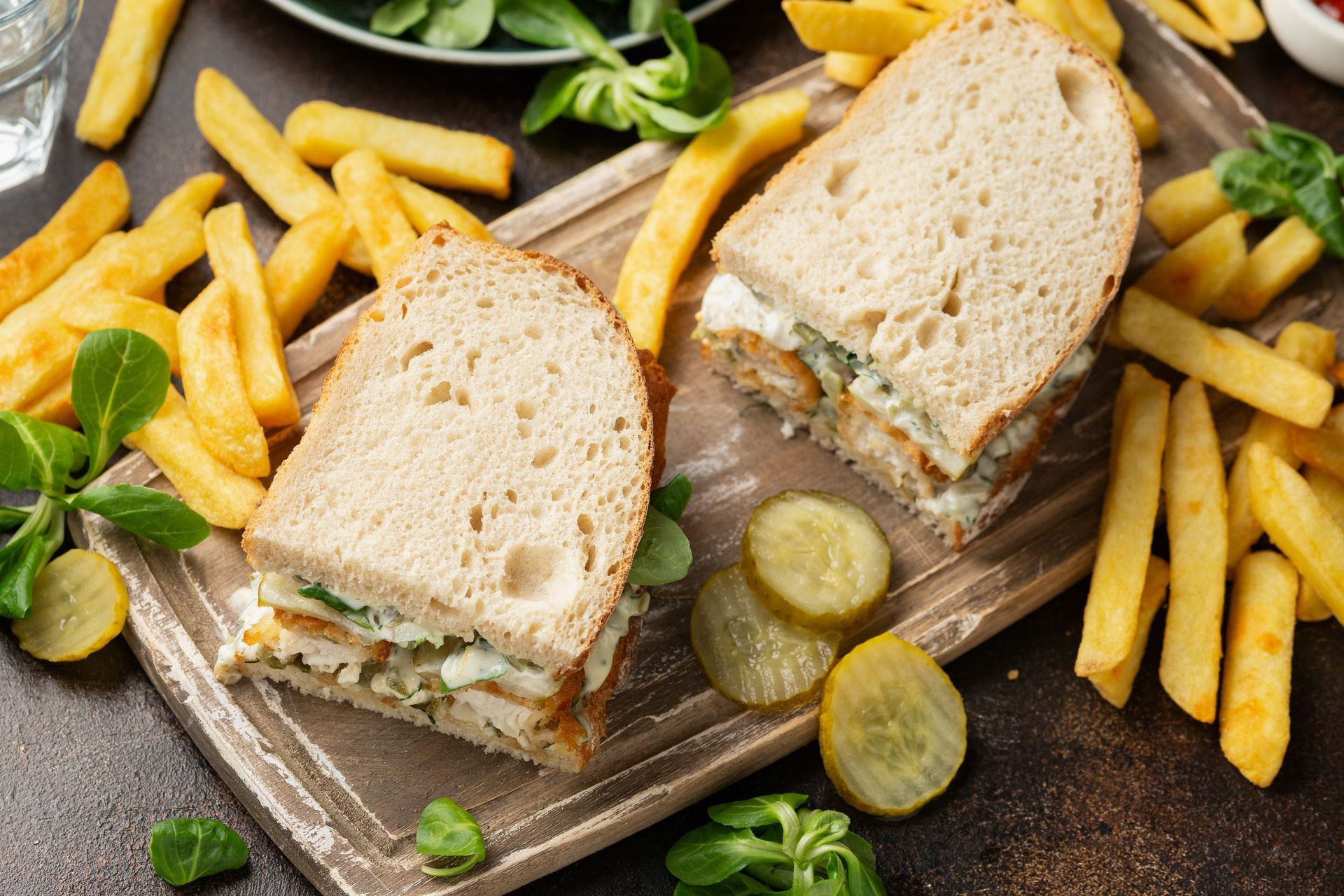 A sunset over a mountain range with a lot of fog