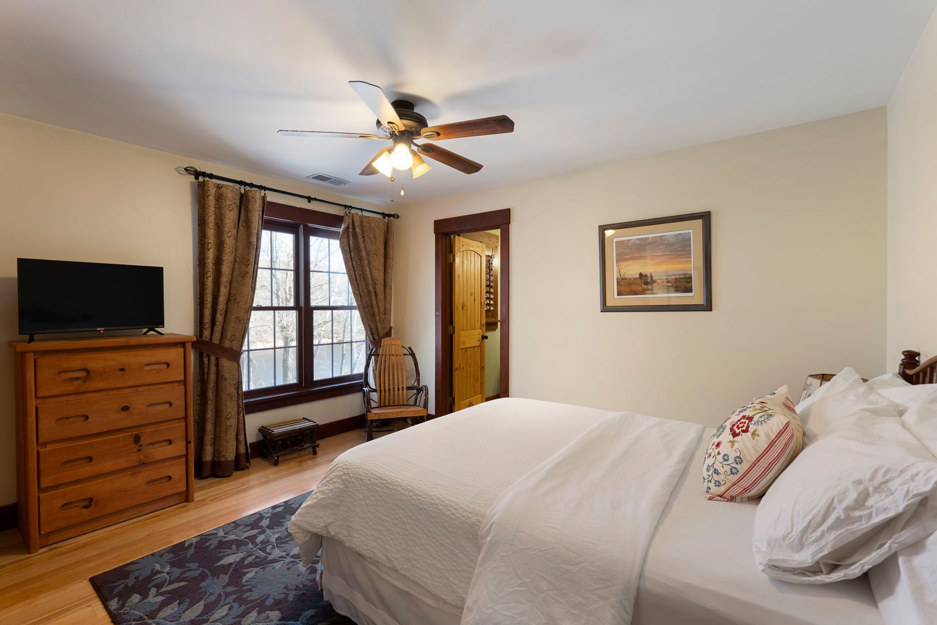 A sunset over a mountain range with a lot of fog