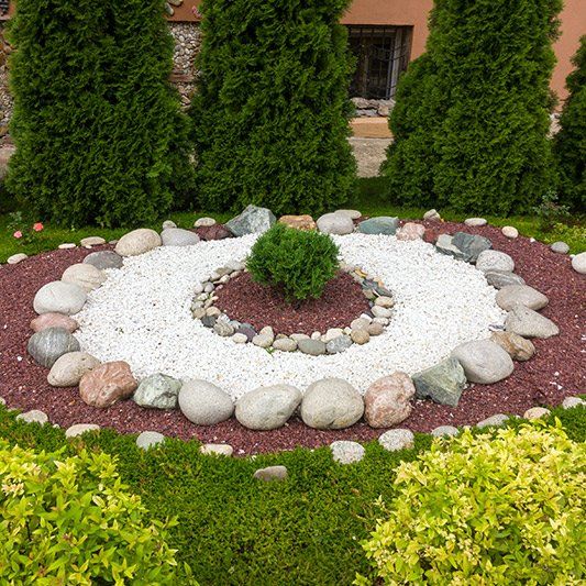 Flower Beds in Park with Stones — Alamogordo, NM — David's Landscaping Design LLC