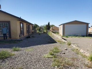 Before Grass Removal Between Two Houses — Alamogordo, NM — David's Landscaping Design LLC