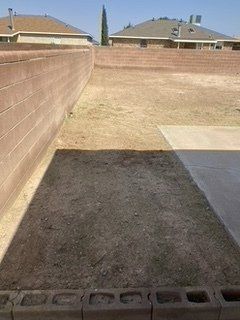 After Grass Removal Near a Wall  — Alamogordo, NM — David's Landscaping Design LLC