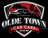Logo for Olde Town Car Care with car silhouette and red accents; includes phone number.