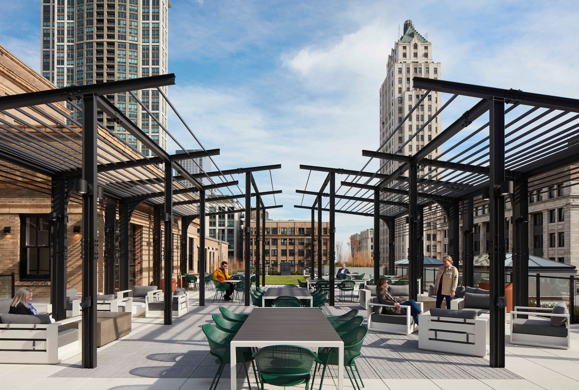 A patio with a table and chairs under a pergola