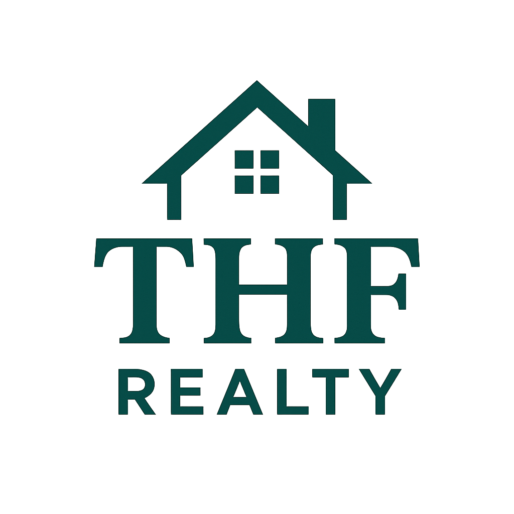 A group of people are shaking hands over a wooden table.