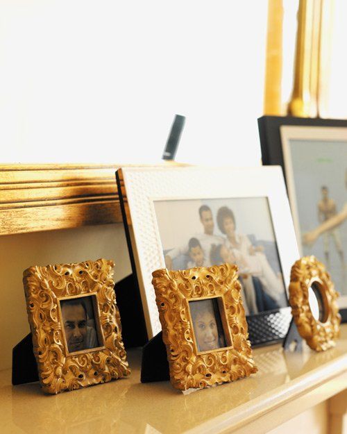 gold square frames on mantle piece