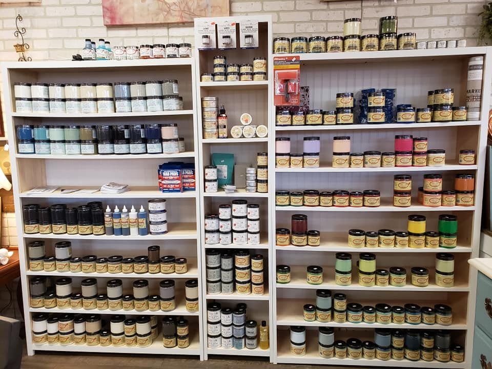 A store filled with lots of jars of paint