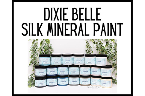 A bunch of jars of dixie belle silk mineral paint are stacked on top of each other.