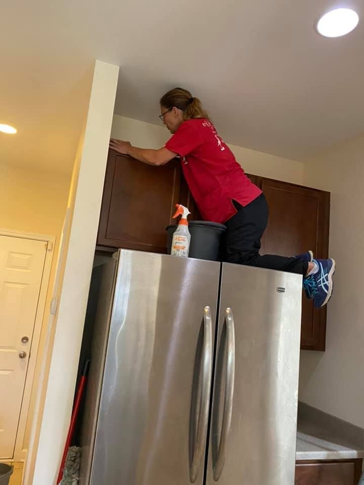 Workers Cleaning The Kitchen Cabinet— Charleston, SC — A Step Above N Beyond Cleaning Service Ltd. Co.