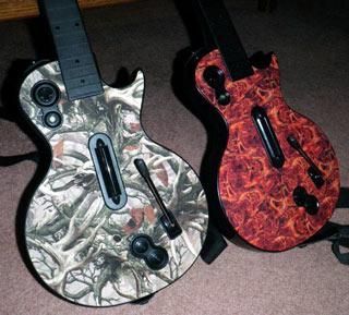 Two guitars are sitting next to each other on the floor