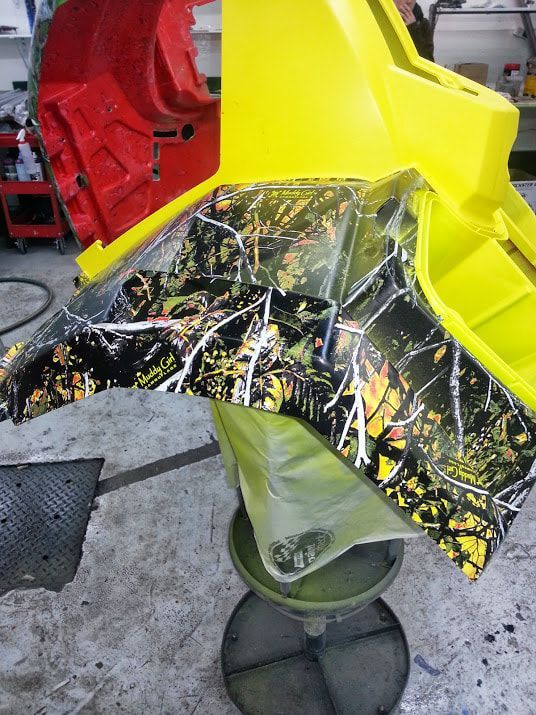 A yellow and black item is sitting on a stool