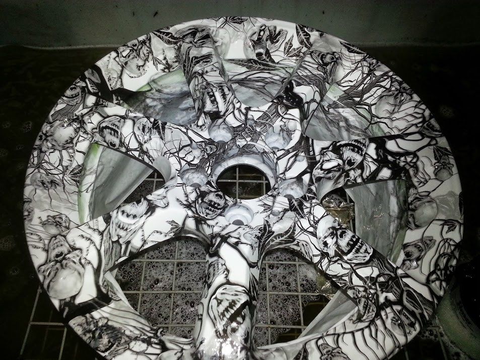 A black and white plate with a skull design on it