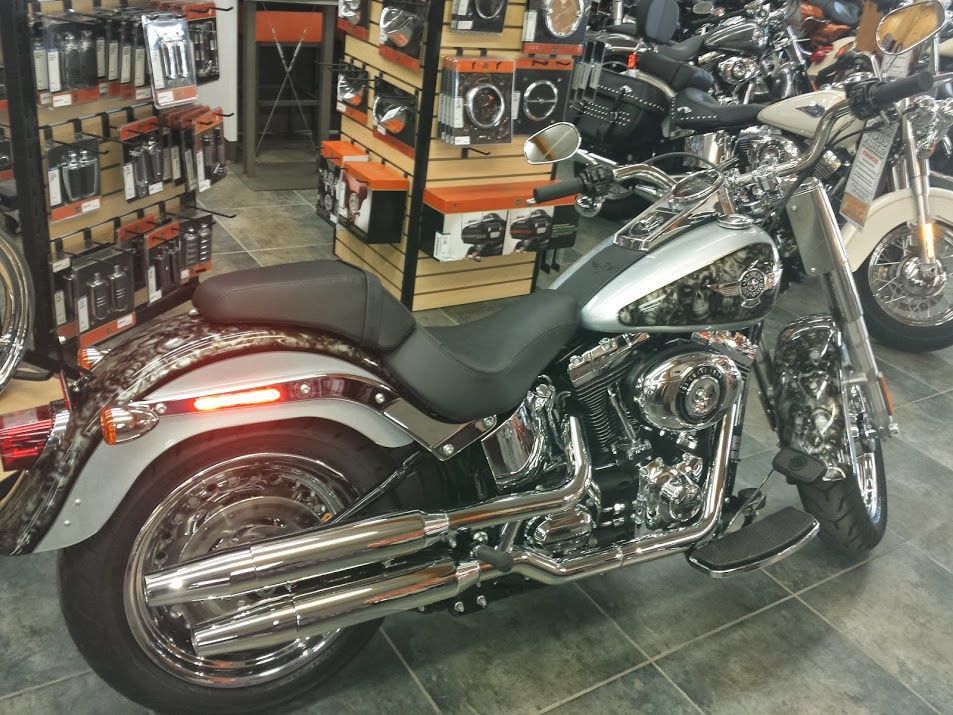 A harley davidson motorcycle is parked in a showroom