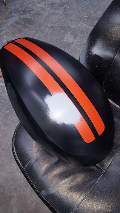 A black object with orange stripes on it