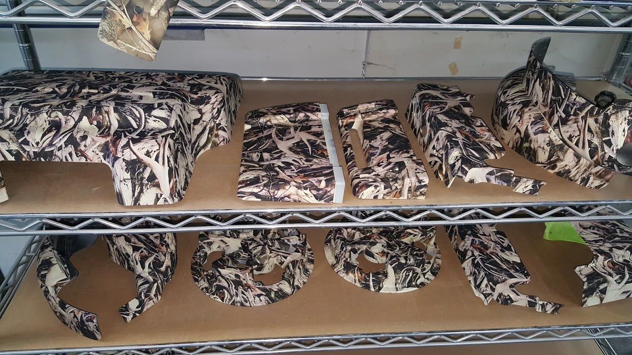 A bunch of pieces of wood are sitting on a shelf